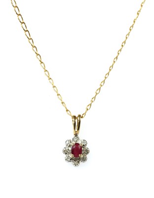 Lot 119 - A 9ct gold ruby and diamond cluster pendant