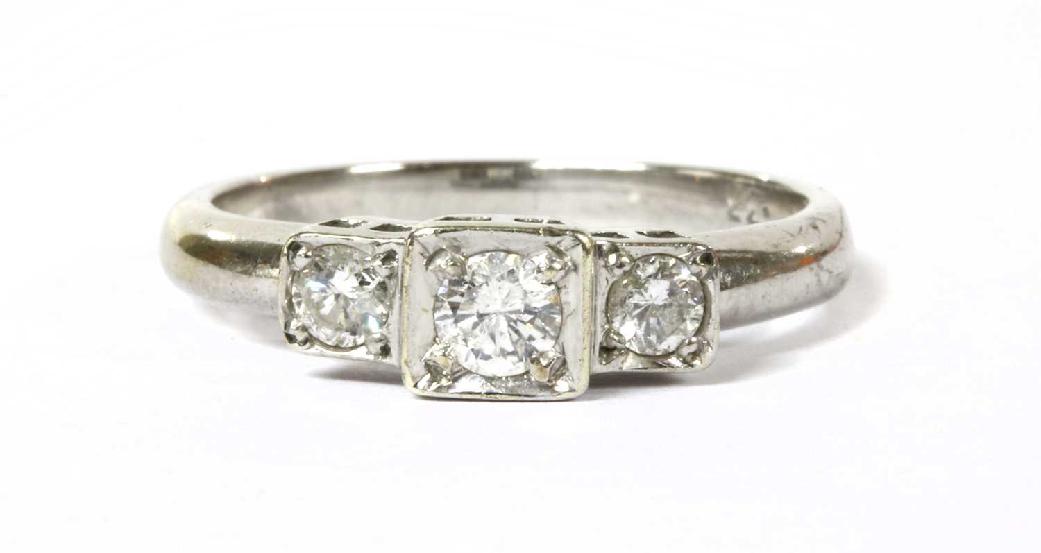 Lot 95 - A 9ct white gold three stone diamond ring