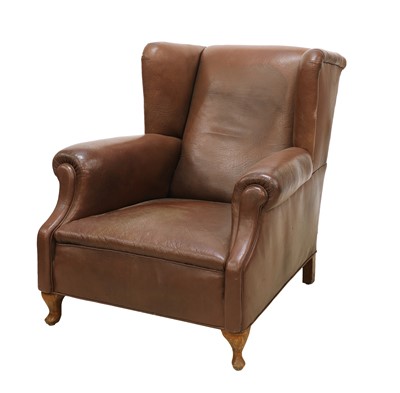 Lot 356 - A brown leather armchair