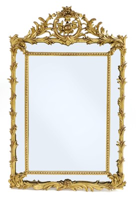 Lot 432 - A French carved giltwood and composition wall mirror