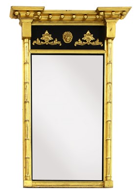 Lot 977 - A Regency-style giltwood and ebonised pier mirror