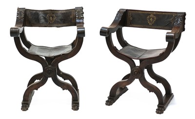 Lot 421 - A pair of Spanish walnut Savonarola-style 'X' framed elbow chairs