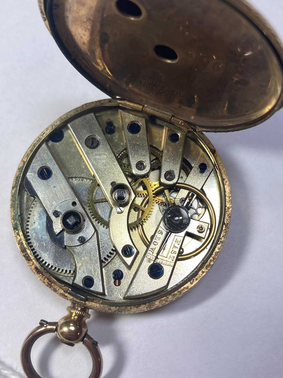 Lot 252 A gold key wound openfaced fob watch,