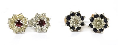 Lot 115 - A pair of white gold ruby and diamond cluster earrings