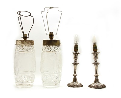 Lot 101 - A pair of cut-glass table lamps