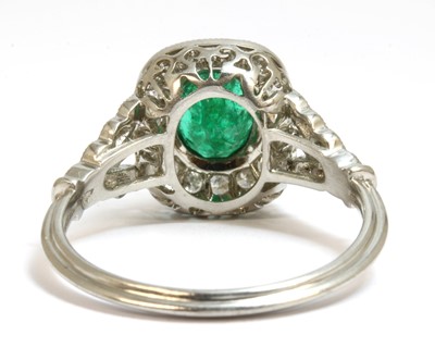 Lot 152 - An emerald and diamond cushion-shaped cluster ring