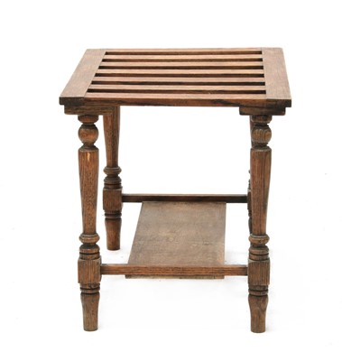 Lot 79 - A country oak luggage stand