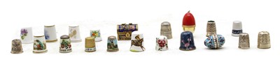 Lot 422 - A collection of silver, brass, bakelite, porcelain and enamel thimbles