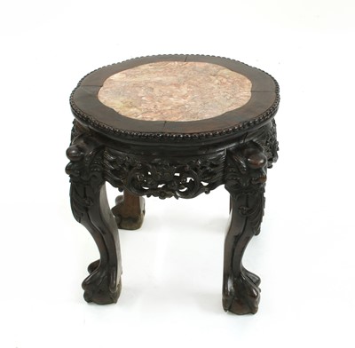 Lot 697 - A Chinese hardwood jardiniere stand