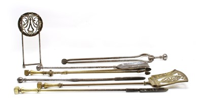 Lot 81 - Two sets of fire irons
