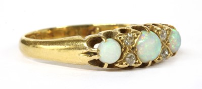 Lot 13 - An Edwardian 18ct gold opal and diamond seven stone ring