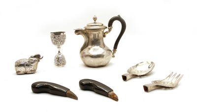 Lot 7 - A collection of white metal items