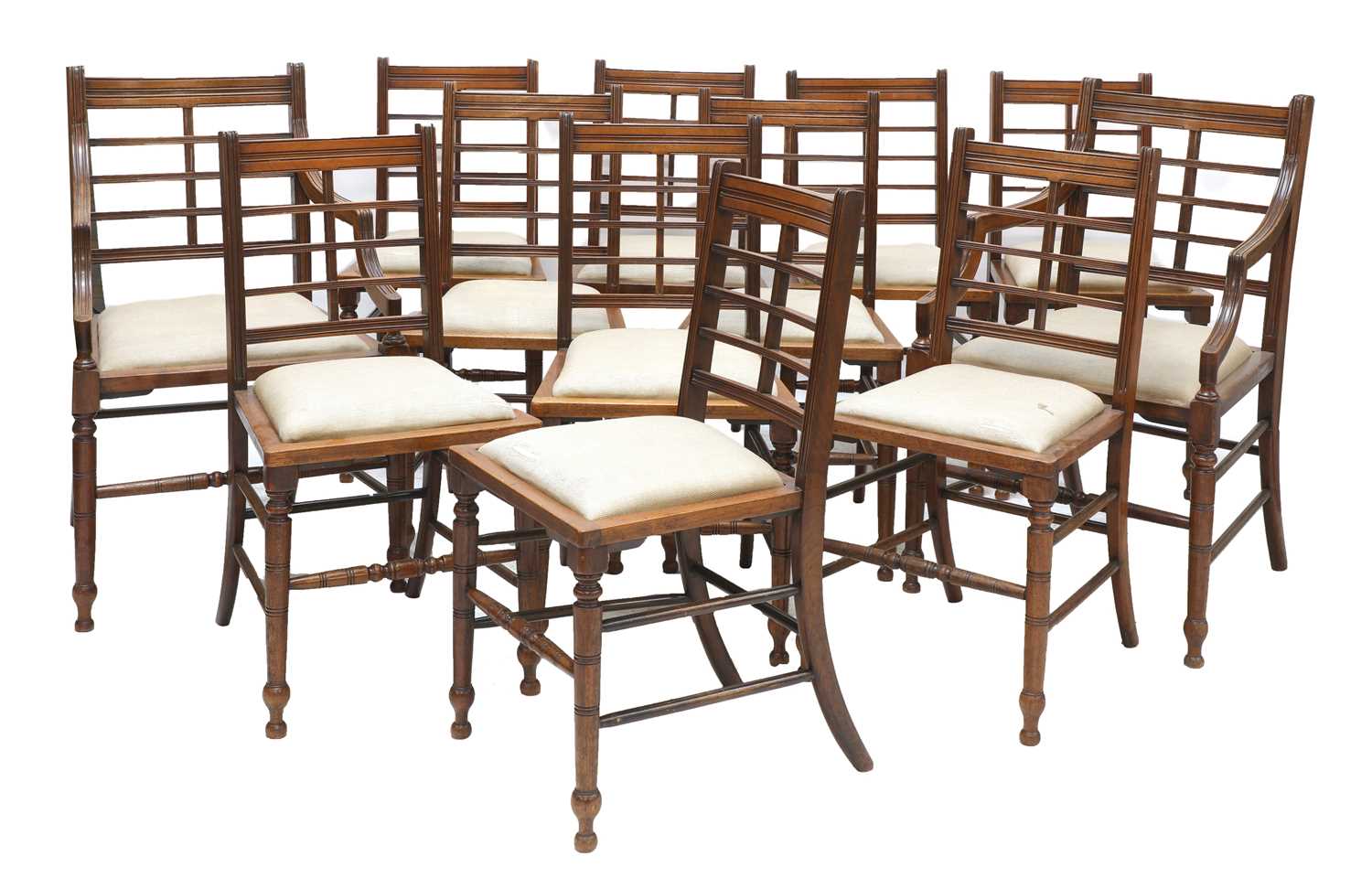 Lot 44 - A set of twelve Arts and Crafts walnut chairs