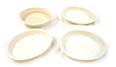 Lot 94 - A set of four large earthenware pottery cream pans