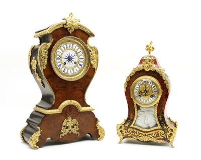 Lot 95 - A French walnut and ormolu mounted mantle clock