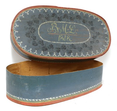 Lot 458 - A large painted pine oval box and cover