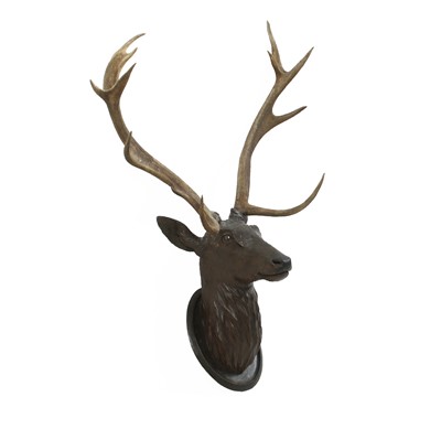 Lot 273 - A Black Forest carved wood stag's head, with mounted antlers