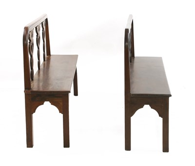 Lot 110 - A pair of Italian neoclassical-style walnut hall seats