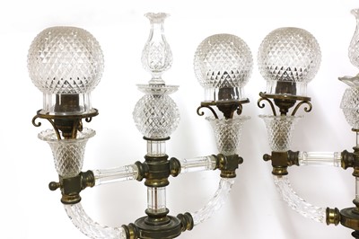 Lot 388 - A pair of cut glass and gilt brass electric lamps