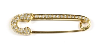 Lot 58 - A gold, diamond set, safety pin-style brooch