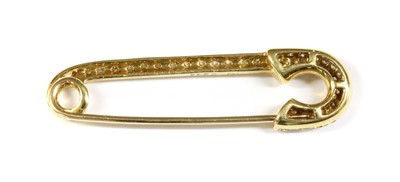 Lot 58 - A gold, diamond set, safety pin-style brooch