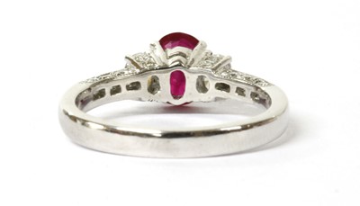 Lot 46 - An 18ct white gold ruby and diamond three stone ring