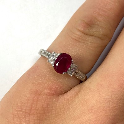 Lot 46 - An 18ct white gold ruby and diamond three stone ring