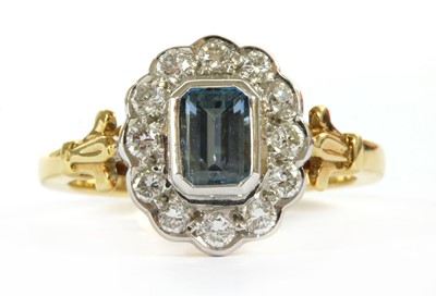 Lot 129 - An 18ct gold aquamarine and diamond cluster ring