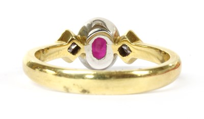 Lot 38 - An 18ct gold ruby and diamond three stone ring
