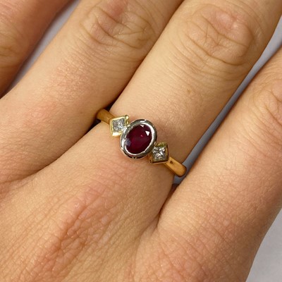 Lot 38 - An 18ct gold ruby and diamond three stone ring