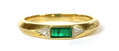 Lot 160 - An 18ct gold emerald and diamond three stone ring