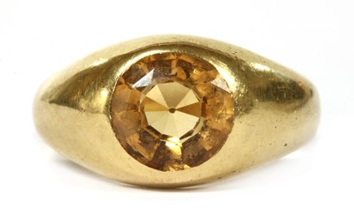 Lot 247 - An Edwardian 18ct gold yellow topaz ring