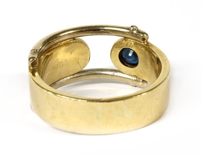 Lot 245 - A gold single stone sapphire ring