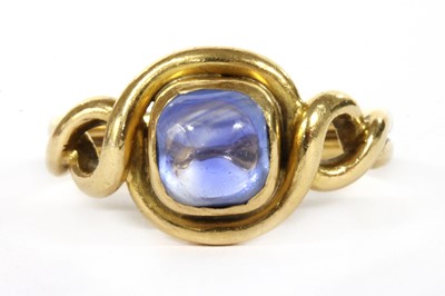 Lot 244 - A gold single stone sapphire ring