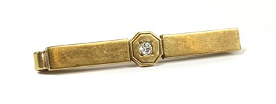 Lot 234 - A 9ct gold diamond set tie slide