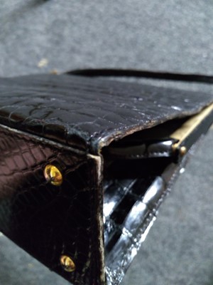 Lot 73 - A vintage black crocodile leather handbag