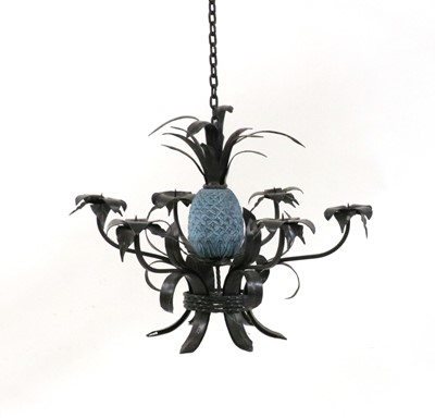 Lot 613 - A wrought iron six branch chandelier with pineapple centre