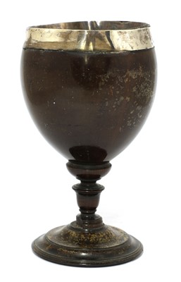 Lot 26 - A George IV silver-mounted coconut cup