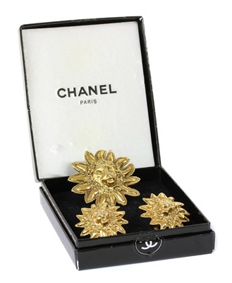 Lot 183 - A Chanel gold-plated lion brooch and earrings suite