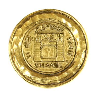 Lot 185 - A Chanel  gold-plated circular brooch