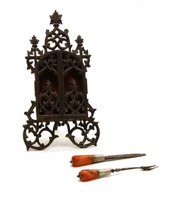 Lot 414 - A carved hardwood ecclesiastical travelling icon case