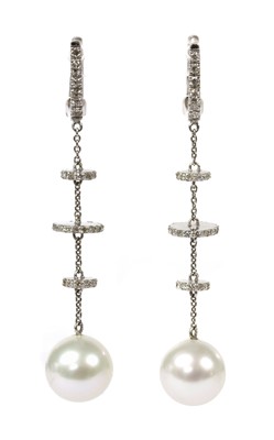 Lot 70 - A pair of 18ct white gold cultured pearl and diamond drop earrings