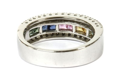 Lot 218 - An 18ct white gold rainbow sapphire and diamond ring