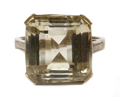 Lot 378 - A gold single stone smoky quartz ring