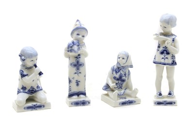 Lot 462 - A collection of four Royal Copenhagen blue and white porcelain figures