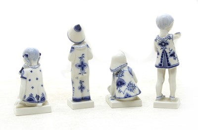 Lot 462 - A collection of four Royal Copenhagen blue and white porcelain figures