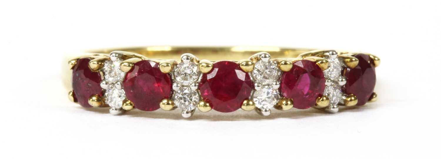 Lot 43 - A gold ruby and diamond half eternity ring