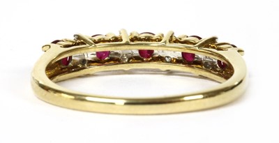 Lot 43 - A gold ruby and diamond half eternity ring