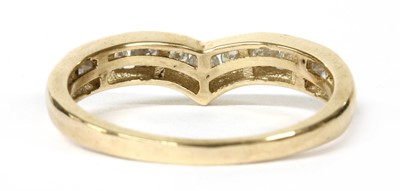 Lot 63 - A gold diamond wishbone half eternity ring