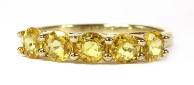 Lot 208 - A gold five stone yellow sapphire ring